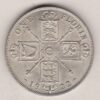 1922 Silver Florin coin. The portrait of King George V on the Obverse. The crowned cruciform shields around central Garter star on the reverse.