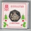 1999 Gibraltar Christmas Fifty Pence Coin. Featuring Queen Elizabeth II on the Obverse. Santa & a Moneys are on the Reverse.