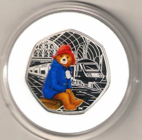 2018 Silver Proof Fifty Pence Paddington At The Station. This coin comes in the original box with certificate as issued by the royal mint.