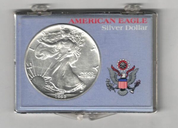 1992 Silver USA One Ounce Eagle cased . The liberty is on the obverse, The eagle is on the reverse. The coin contains one ounce of 999 fine silver.