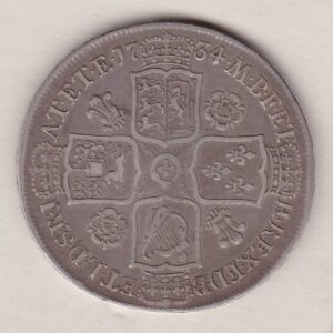 1734 Silver Halfcrown coin with King George II on the Obverse. Crowned cruciform shields with central Garter stars on the Reverse.