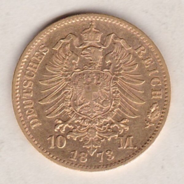 1873 F Germany Gold Ten Mark coin featuring the bust of Karl I on the obverse. The crowned imperial eagle on the reverse.