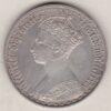 1876 Silver Gothic Florin Coin. The Obverse features a crowned bust of Queen Victoria. The Reverse features a shield with denomination.