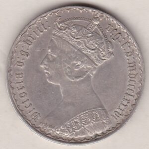 1886 Silver Gothic Florin Coin. The Obverse features a crowned bust of Queen Victoria. The Reverse features a shield with denomination.