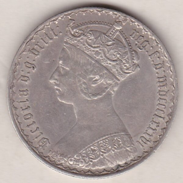 1886 Silver Gothic Florin Coin. The Obverse features a crowned bust of Queen Victoria. The Reverse features a shield with denomination.