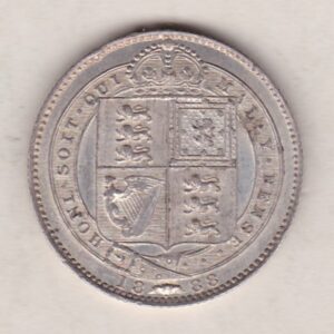 1888 Silver Shilling coin featuring Queen Victoria on the Obverse. The Reverse features the crowned Royal shield within Garter, with divided date below.