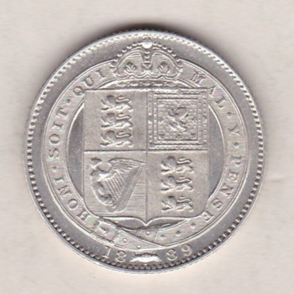 1889 Silver Shilling Small Head coin featuring Queen Victoria on the Obverse. The Reverse features the crowned Royal shield within Garter.