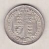 1890 Silver Shilling coin featuring Queen Victoria on the Obverse. The Reverse features the crowned Royal shield within Garter, with divided date below.