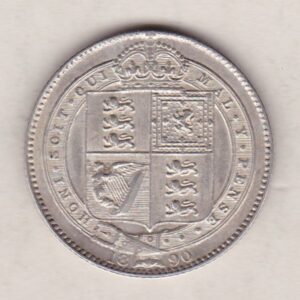 1890 Silver Shilling coin featuring Queen Victoria on the Obverse. The Reverse features the crowned Royal shield within Garter, with divided date below.