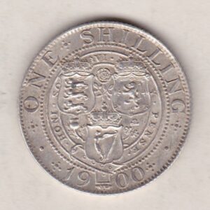 1900 Silver Shilling coin featuring Queen Victoria on the Obverse. The Reverse features the crowned shields of arms with national flower emblems between.