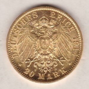 1914 A Germany Gold Twenty Mark coin featuring the bust of Wilhelm II on the obverse. The crowned imperial eagle on the reverse.