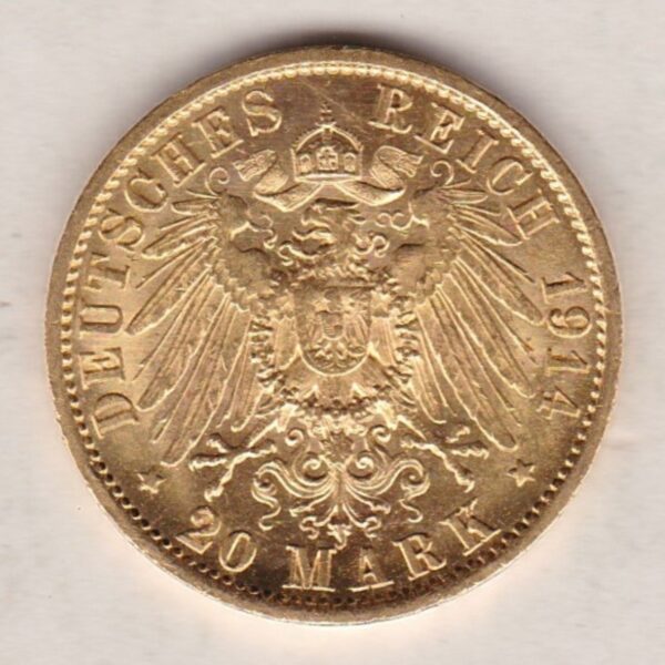 1914 A Germany Gold Twenty Mark coin featuring the bust of Wilhelm II on the obverse. The crowned imperial eagle on the reverse.