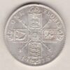 1915 Silver Florin coin. The portrait of King George V on the Obverse. The crowned cruciform shields around central Garter star on the reverse.