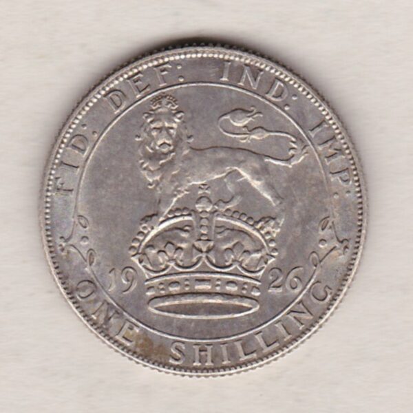 1926 Modified Effigy Silver Shilling coin featuring King George V on the Obverse. The Reverse features a crowned lion with date and denomination.