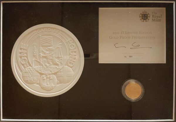 2011 Gold Proof One Pound Cardiff coin. This coin comes in a wooden presentation frame with plaster mould and certificate number 0001.