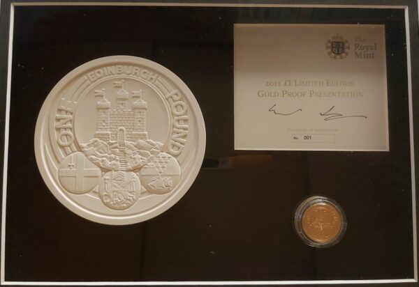 2011 Gold Proof One Pound Edinburgh coin. This coin comes in a wooden presentation frame with plaster mould and certificate number 0001.