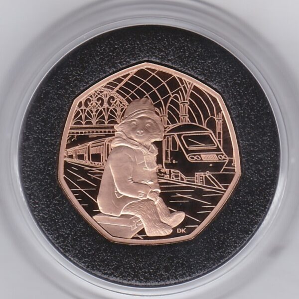 2018 Gold Proof Fifty Pence Paddington At The Station. This coin was struck to celebrate Paddington Bear. The coin comes boxed with certificate.