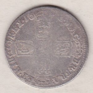 1696 silver shilling coin featuring the laureate or draped bust of William III on the Obverse. The crowned cruciform shields on the Reverse.