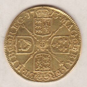 1713 Gold Guinea Coin featuring the portrait of Queen Anne on the obverse. The crowned cruciform shields around central Garter star on the reverse.