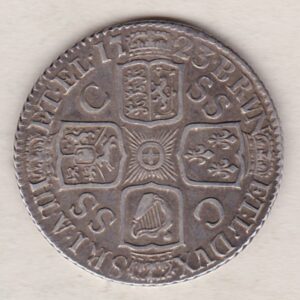 1723 silver shilling coin featuring a laureate and draped bust of George I. The crowned cruciform shields with central Garter star on the Reverse.