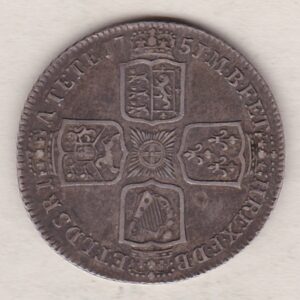 1751 silver shilling coin featuring a laureate and draped bust of George II. The crowned cruciform shields with central Garter star on the Reverse.