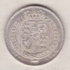 1824 silver shilling coin featuring King George IV on the Obverse. The Reverse has the crowned Royal shield of arms within Garter, date below.