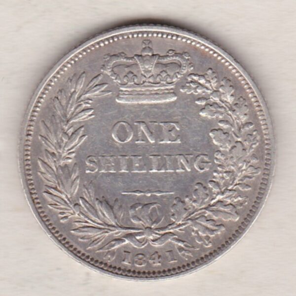 1841 silver shilling coin featuring Queen Victoria young head on the Obverse. The Reverse has a crown, laurel and oak leaves within an open wreath.