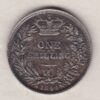 1844 silver shilling coin featuring Queen Victoria young head on the Obverse. The Reverse has a crown, laurel and oak leaves within an open wreath.