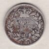 1851 silver shilling coin featuring Queen Victoria young head on the Obverse. The Reverse has a crown, laurel and oak leaves within an open wreath.