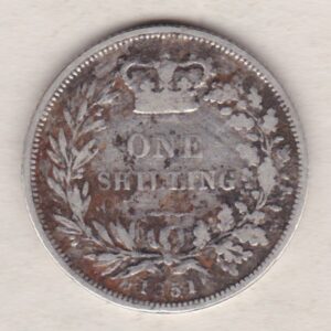 1851 silver shilling coin featuring Queen Victoria young head on the Obverse. The Reverse has a crown, laurel and oak leaves within an open wreath.