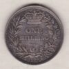 1855 silver shilling coin featuring Queen Victoria young head on the Obverse. The Reverse has a crown, laurel and oak leaves within an open wreath.