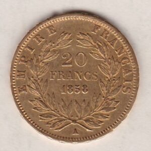 1858 A France Gold Twenty Francs coin featuring Napoleon III on the Obverse. The reverse has the denomination above the date within a wreath.