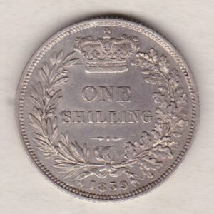 1859 silver shilling coin featuring Queen Victoria young head on the Obverse. The Reverse has a crown, laurel and oak leaves within an open wreath.