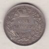 1861 silver shilling coin featuring Queen Victoria young head on the Obverse. The Reverse has a crown, laurel and oak leaves within an open wreath.