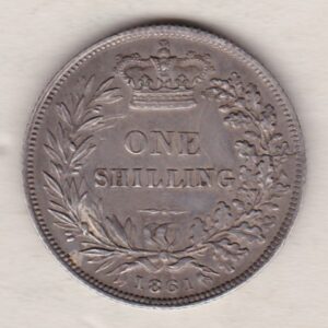 1861 silver shilling coin featuring Queen Victoria young head on the Obverse. The Reverse has a crown, laurel and oak leaves within an open wreath.