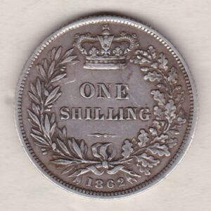 1862 silver shilling coin featuring Queen Victoria young head on the Obverse. The Reverse has a crown, laurel and oak leaves within an open wreath.