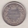 1864 silver shilling coin featuring Queen Victoria young head on the Obverse. The Reverse has a crown, laurel and oak leaves within an open wreath.