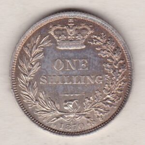 1870 silver shilling coin featuring Queen Victoria young head on the Obverse. The Reverse has a crown, laurel and oak leaves within an open wreath.