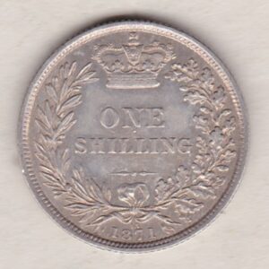 1871 silver shilling coin featuring Queen Victoria young head on the Obverse. The Reverse has a crown, laurel and oak leaves within an open wreath.