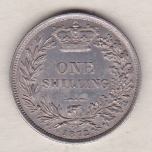 1872 silver shilling coin featuring Queen Victoria young head on the Obverse. The Reverse has a crown, laurel and oak leaves within an open wreath.