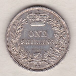 1876 silver shilling coin featuring Queen Victoria young head on the Obverse. The Reverse has a crown, laurel and oak leaves within an open wreath.