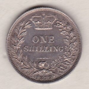 1879 silver shilling coin featuring Queen Victoria young head on the Obverse. The Reverse has a crown, laurel and oak leaves within an open wreath.