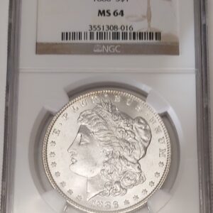 1886 Silver USA Morgan Dollar coin featuring lady liberty on the obverse. The eagle holding arrows and an olive branch on the reverse.