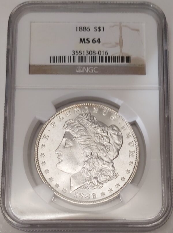 1886 Silver USA Morgan Dollar coin featuring lady liberty on the obverse. The eagle holding arrows and an olive branch on the reverse.