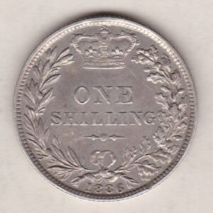 1886 silver shilling coin featuring Queen Victoria young head on the Obverse. The Reverse has a crown, laurel and oak leaves within an open wreath.