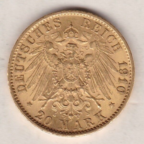 1910 A Germany Gold Twenty Mark coin featuring the bust of Wilhelm II on the obverse. The crowned imperial eagle on the reverse.