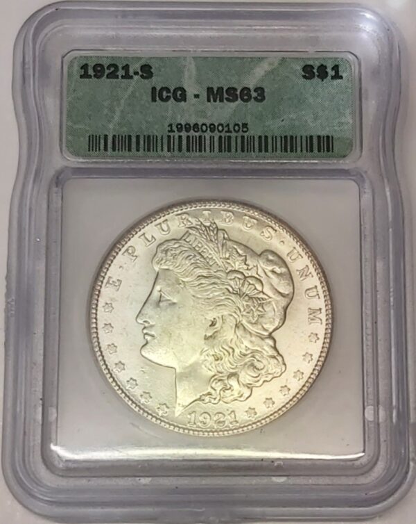 1921 S Silver USA Morgan Dollar coin featuring lady liberty on the obverse. The eagle holding arrows and an olive branch on the reverse.