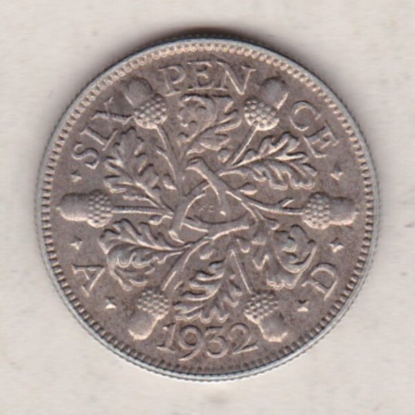1932 Silver Sixpence coin featuring King George V on the Obverse. The Reverse features three oak sprigs with date and denomination.