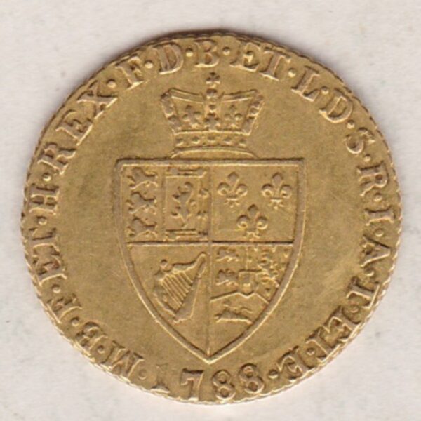 1788 Gold Half Guinea Coin featuring the laureate head portrait of King George III on the obverse. The reverse features the crowned quartered shield.