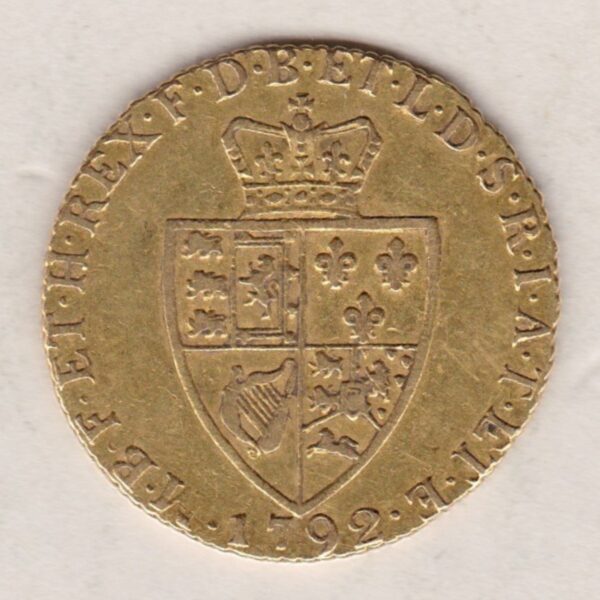 1792 Gold Guinea Coin featuring the fifth laureate head portrait of King George III on the obverse. The spade-shaped shield design is on the reverse.